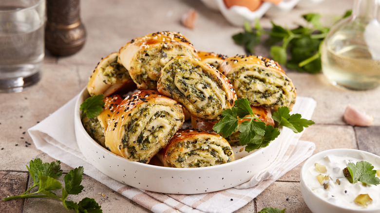 Puff pastry rolls stuffed with cheese and spinach