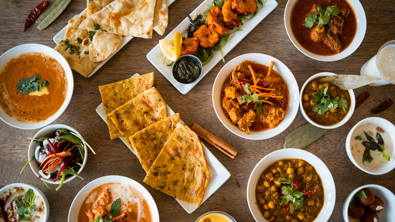 table spread with Indian dishes 