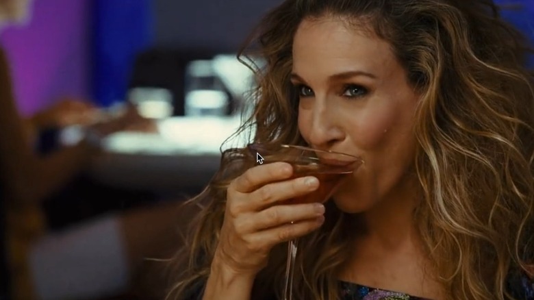 Carrie Bradshaw sipping cosmopolitan cocktail in Sex and the City