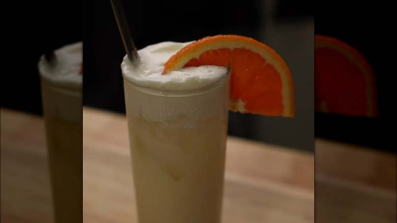 Orange whip cocktail garnished with orange slice
