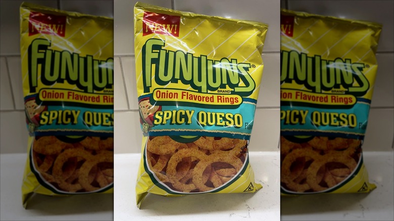 A bag of Funyuns Spicy Queso Flavored on a kitchen counter