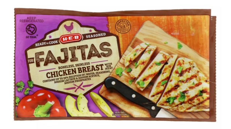 Packet of H-E-B seasoned chicken breast for fajitas on a white background
