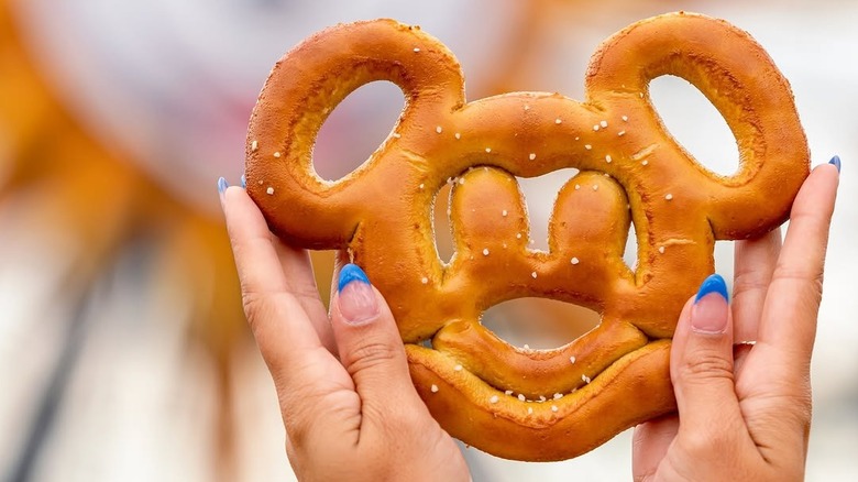 hands holding a mickey pretzel