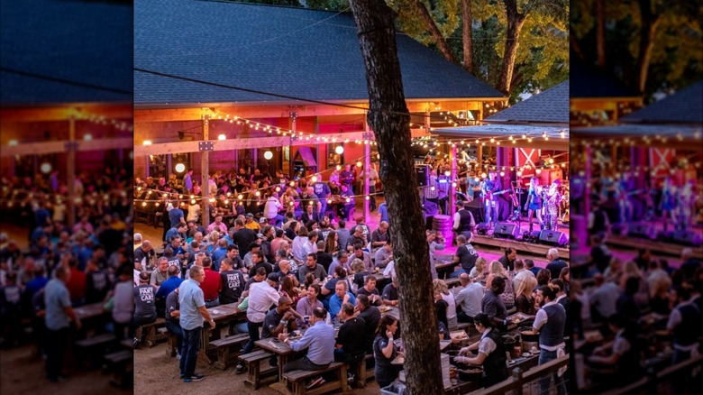 Crowded tables of beer garden at night