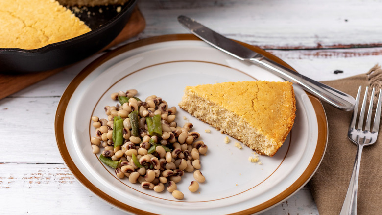 Black-eye peas with cornbread on an old-fashioned plate
