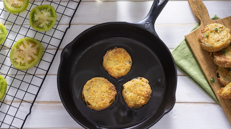 Fried green tomatoes in skillet