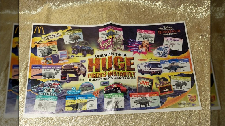 Mirrored image of Hatch, Match, & Win Game card on gold background