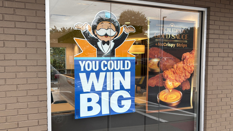A sign at fast food franchise McDonalds advertising the return of their Monopoly game.