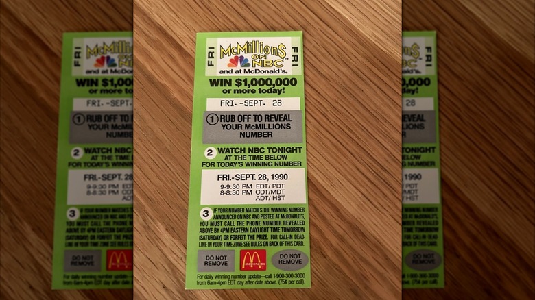 McMillions on NBC game card on wooden table, mirrored image