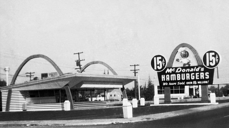 Exterior view of a McDonalds fast food restaurant in 1960s, black and white image