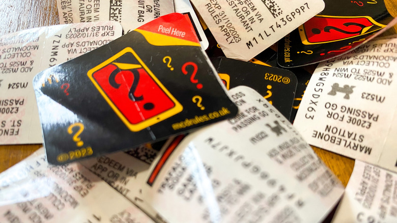 A pile of McDonald's Monopoly game tickets
