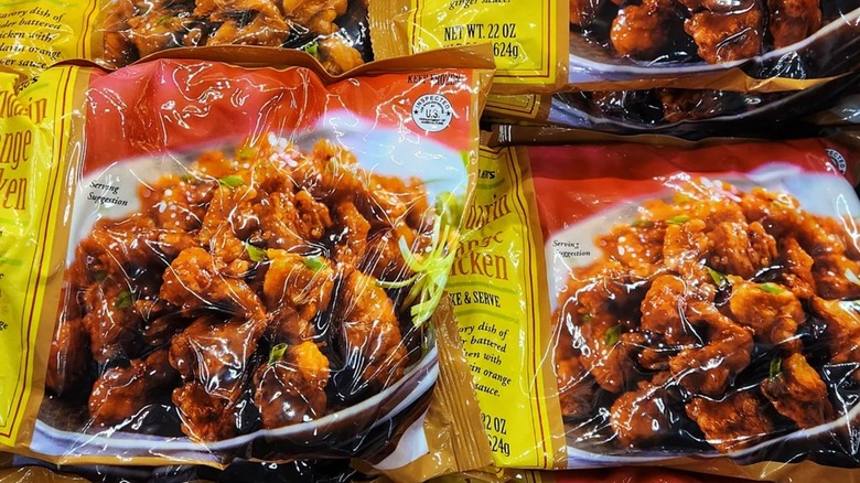 Bag of Trader Joe's Mandarin Chicken with tiny pieces of chicken on colorful tablecloth