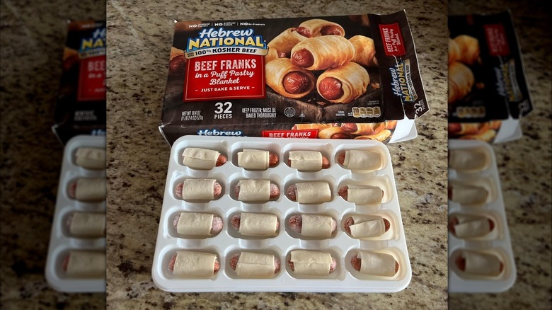 An open package of Hebrew National Beef Franks in a Puff Pastry Blanket with the food displayed on a kitchen counter