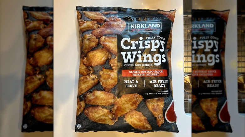 A bag of Kirkland Signature Crispy Wings with Classic Buffalo Sauce on a table
