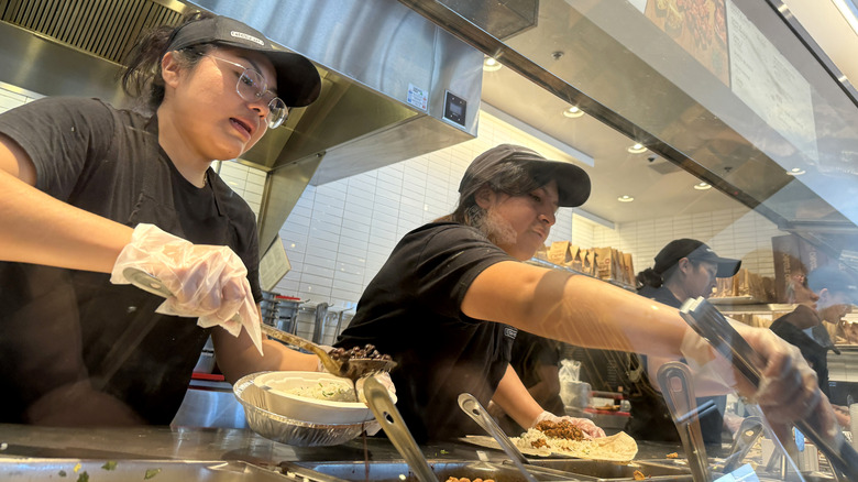 Chipotle workers serving food