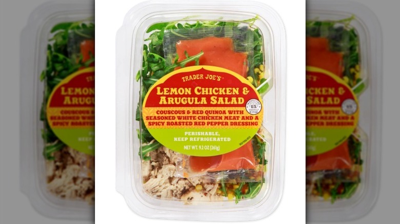 Trader Joe's chicken and arugula salad on a white background
