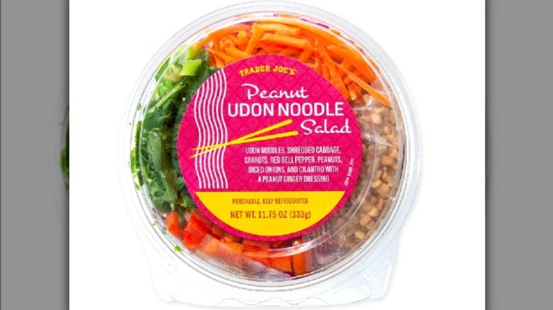 Peanut udon noodle salad on a white background