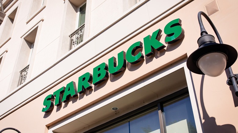 closeup of Starbucks logo sign on the store facade exterior