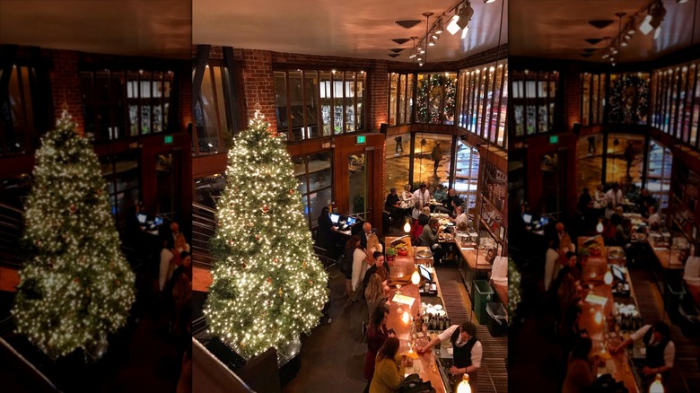 Looking down at small restaurant, dim lit with Christmas tree