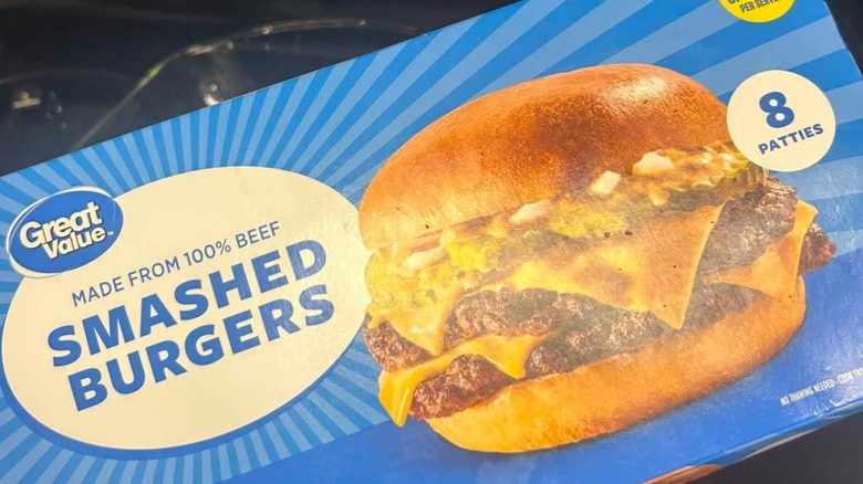 A blue box of Great Value brand Smashed Burgers