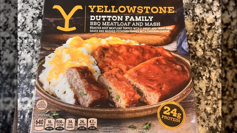 A box of Yellowstone Dutton Family BBQ Meatloaf and Mash sitting on a marble table top