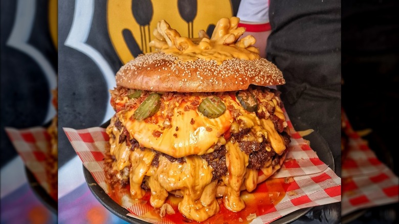 OG Big Brother burger challenge with melty cheese on tray