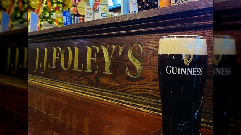 Pint of Guinness on the bar with J.J. Foley's engraving