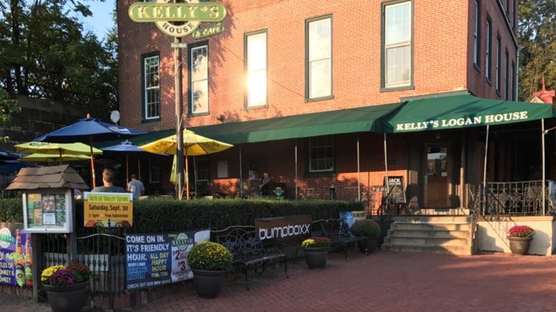 Exterior of Kelly's Logan house with customers at tables outside