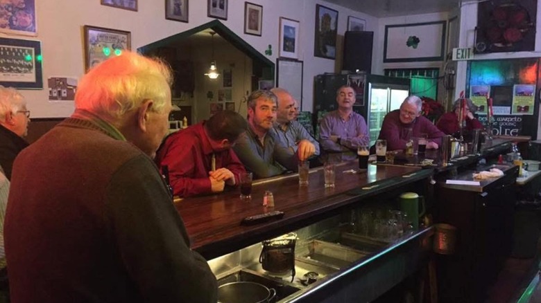 People gathered at the bat at the Golden Ace Inn