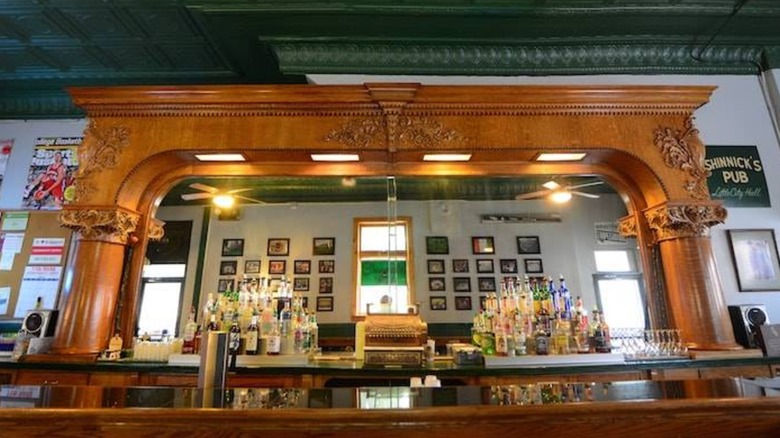 Bar at Shinnick's with mirro, bottles, and signs