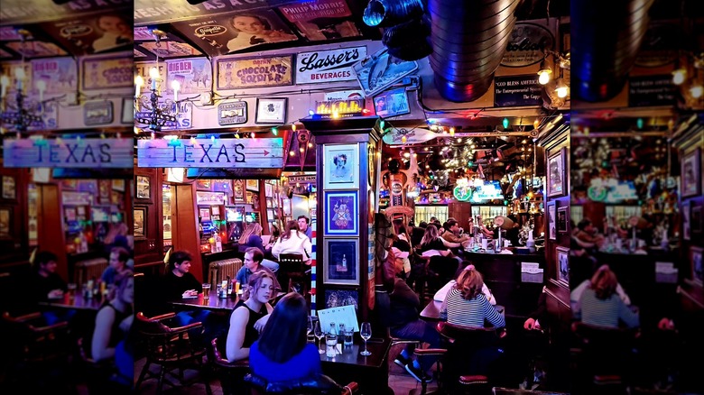 Interior of The Green Door Tavern with customers at tables