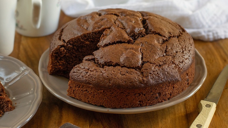 chocolate mayonnaise cake with slice cut on plate