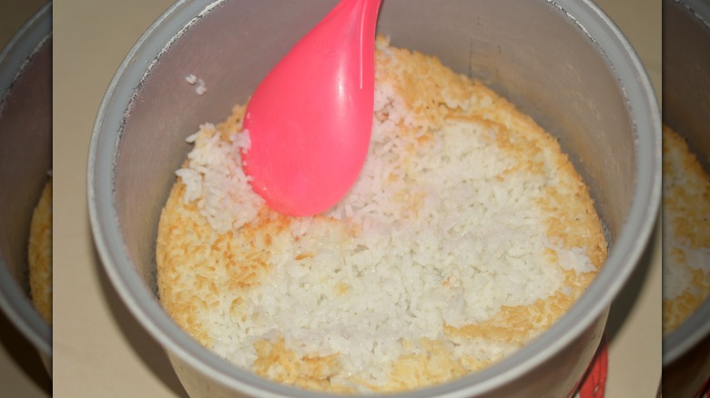Close-up of a pot with rice scorched to the bottom mirrored image