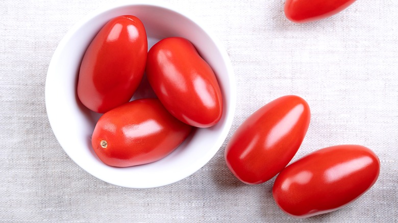 Roma tomatoes in a white bowl