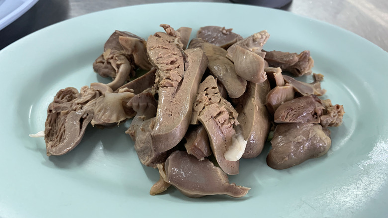 Chopped chicken liver on blue plate
