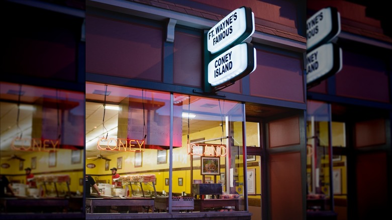 Exterior of Coney Island with neon signs and large front window