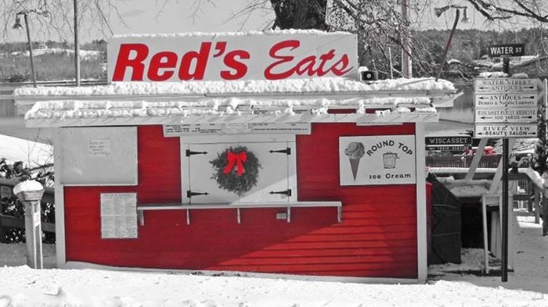Black and white photo of Red's Eats stand with building in red