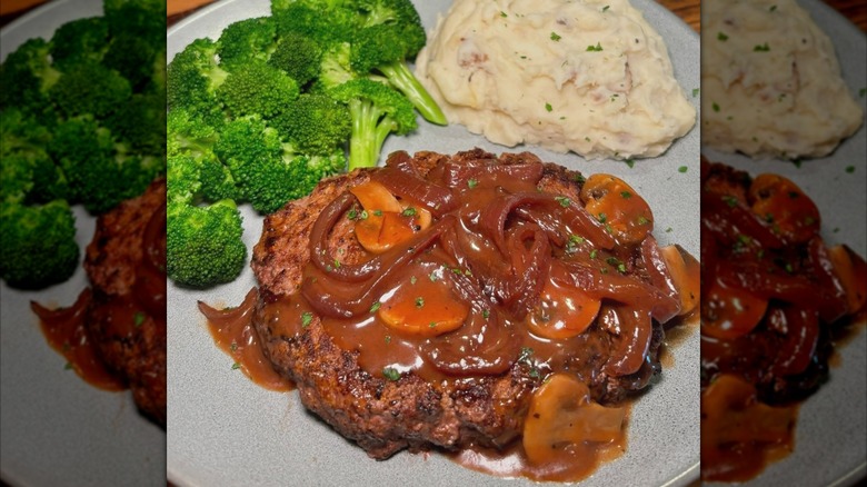 Canberra Chopped Steak with mushroom sauce, broccoli, and mashed potatoes from Outback Steakhouse