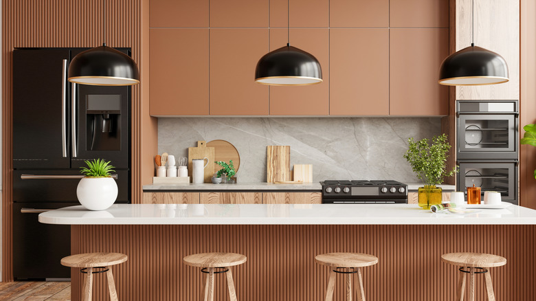 A modern kitchen with warm colors