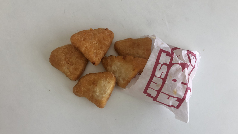 Sheetz Mac N' Cheese bites spilling out of paper sleeve