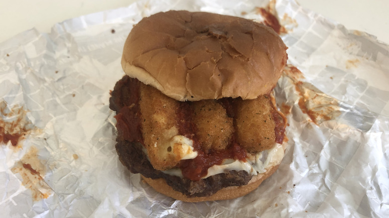 Sheetz Big Mozz burger with sauce and mozzarella sticks.