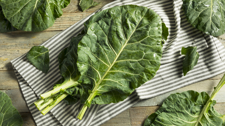Pile of collard greens on striped linen
