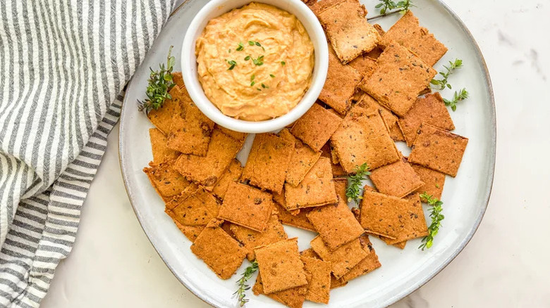 plate of crackers with dip