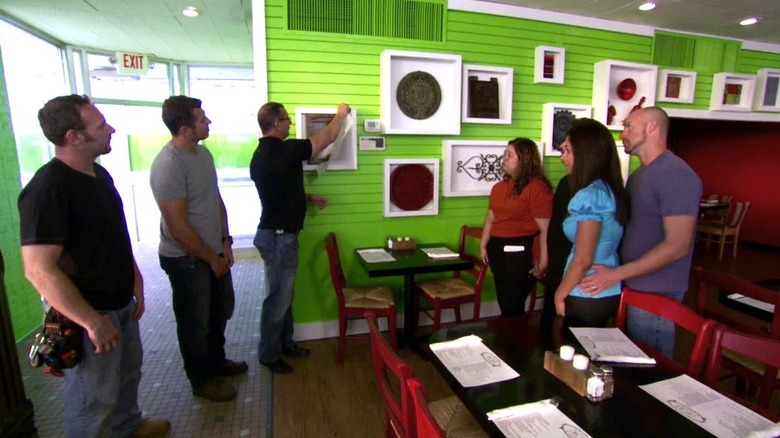 Robert Irvine with staff lined up inside Dinner Bell restaurant