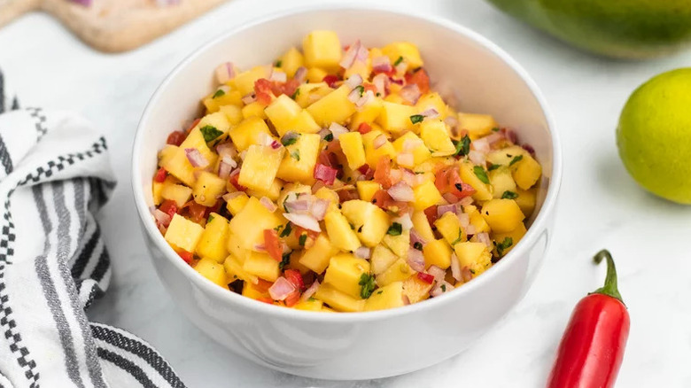 Mango Salsa in a white bowl on table