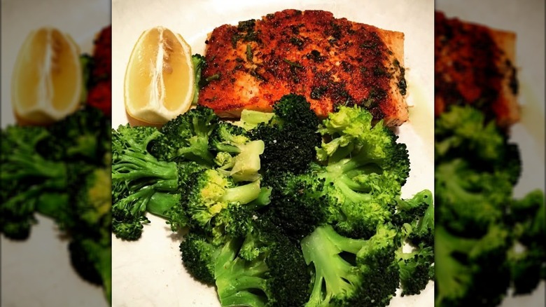 Olive Garden's herb-grilled salmon with broccoli and lemon wedge