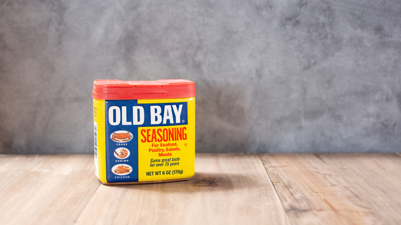 Tin of Old Bay Seasoning on wooden counter