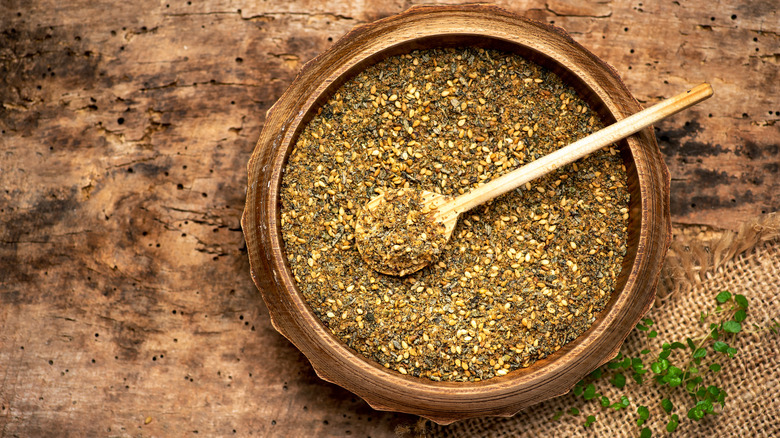 Overhead view of za'atar in wooden bowl