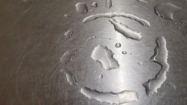 Water droplets on stainless steel surface