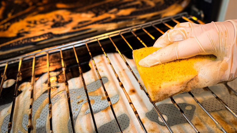 Cleaning oven rack with sponge